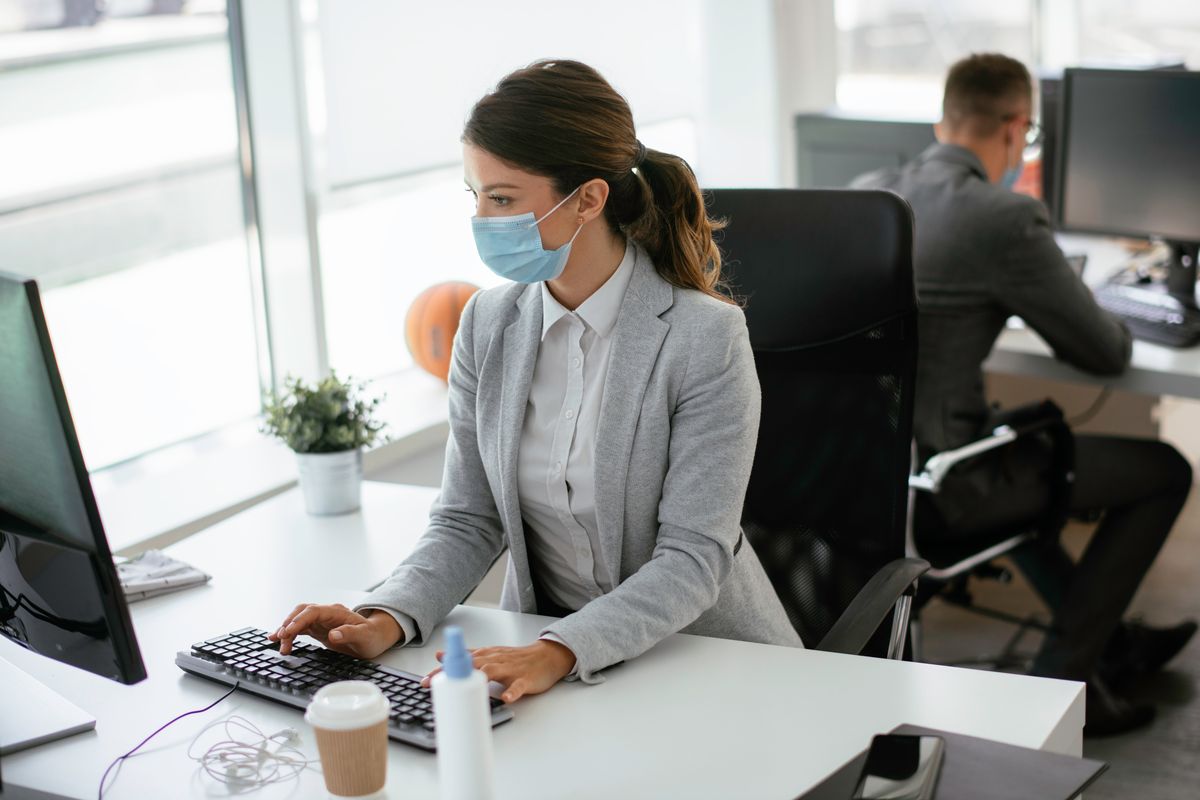 Beautiful,Businesswoman,With,Medical,Mask,Working,In,Office.,Covid-19,Concept.